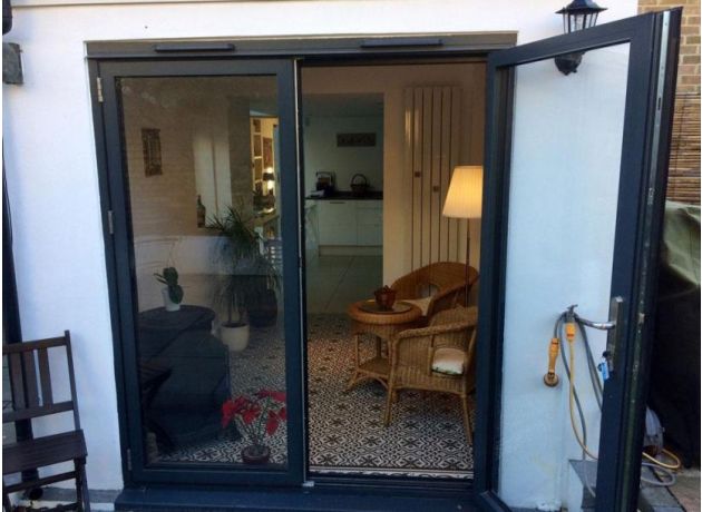 Status 1.8M French Aluminium doors add light into a side extension