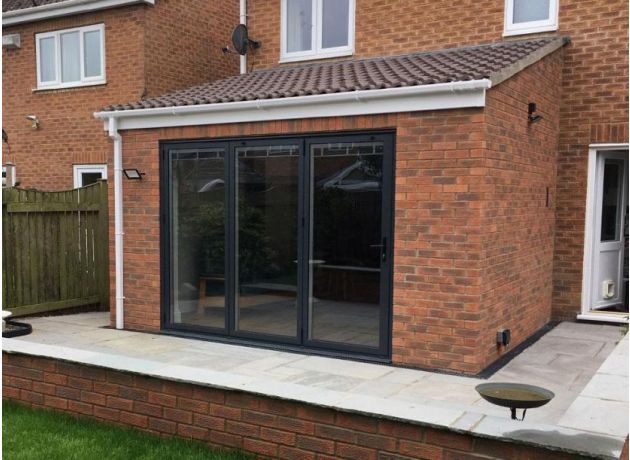 Full extension view - Status Custom Grey Aluminium Bi-fold Doors Double Glazed Left Opening